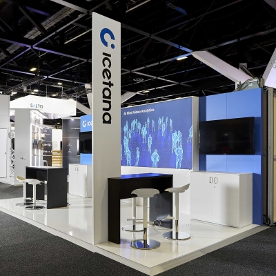 An extraordinary experience: a trade show booth featuring large commercial LED screens and digital displays showcasing the Icetana logo.