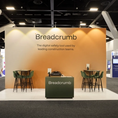 Breadcrumb custom exhibition stand built by exhibition stand builders in Australia featuring branded meeting spaces and trade show display walls