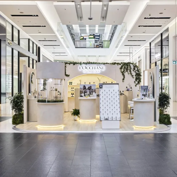 L’Occitane retail pop-up by Cre8 Co featuring custom counters, product displays and greenery